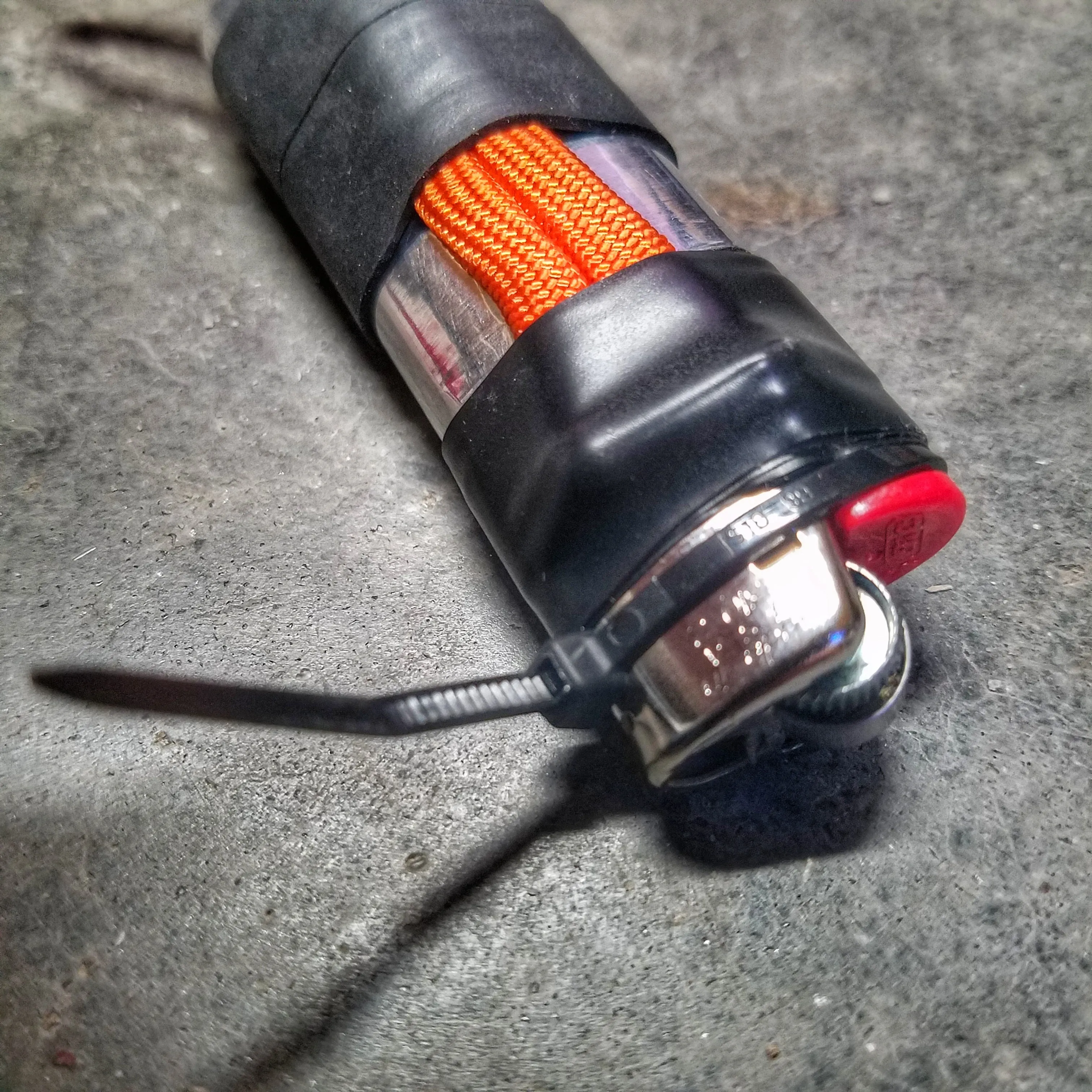 Survival Kit Lighter - Fire Starter outfitted with supplies.